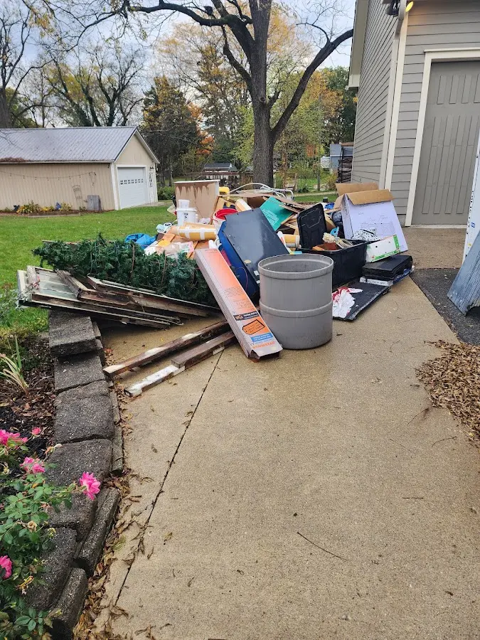 Dumpster being loaded with debris for Commercial Dumpster Rental in North Barrington
